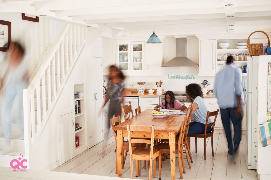 Family enjoying an Airbnb in a clean kitchen by QC Maid Service